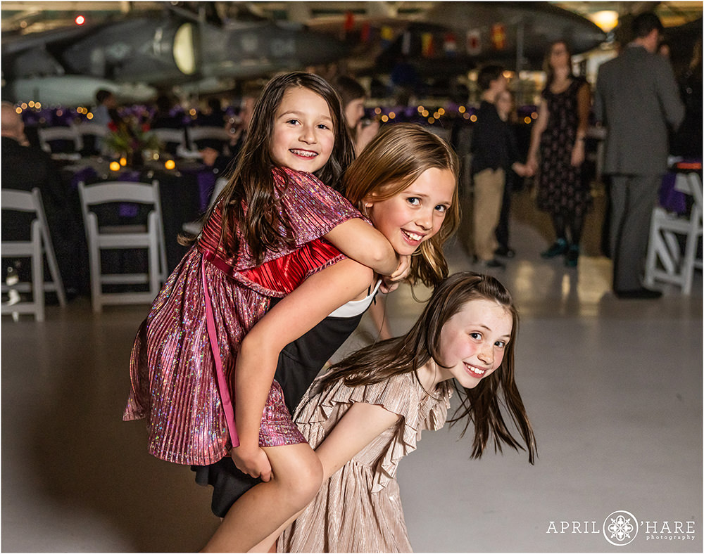 Three girls having fun at a bar mitzvah party at Wings Over the Rockies in Denver CO