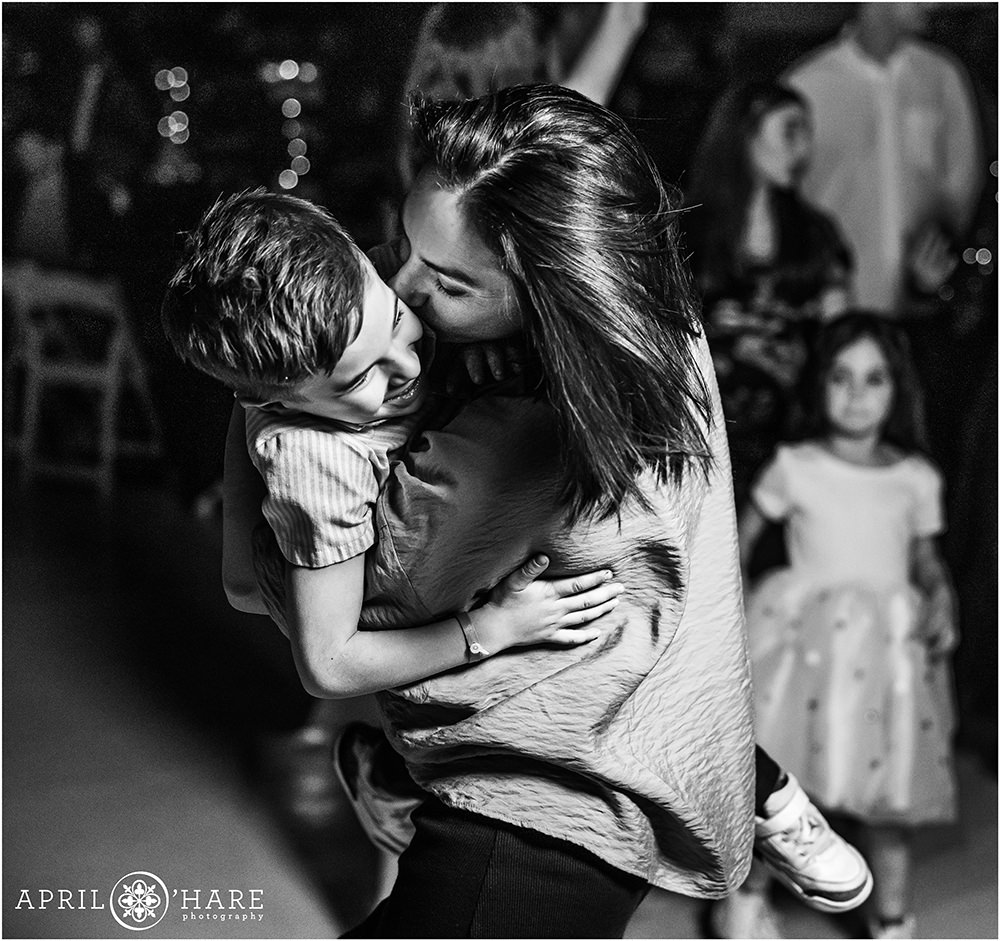 Sweet moment of a mom dancing with her son at a bar mitzvah party in Denver