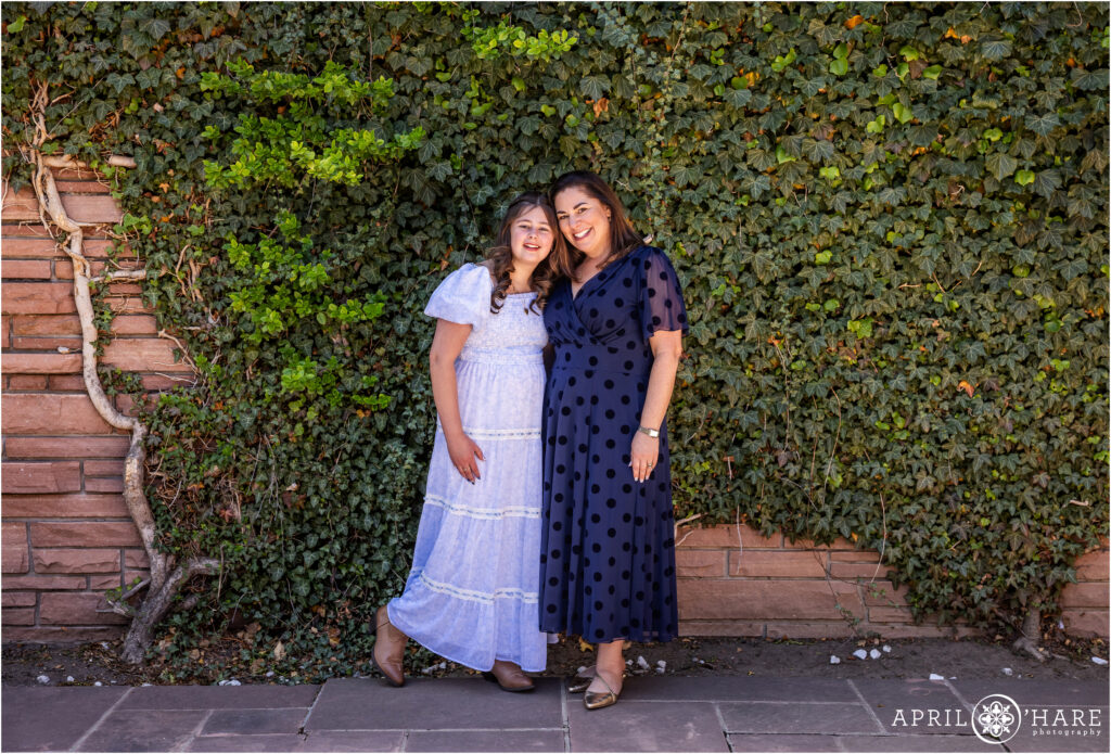 A girl and her mom pose for a portrait on the day of her bat mitzvah at Temple Emanuel in Denver