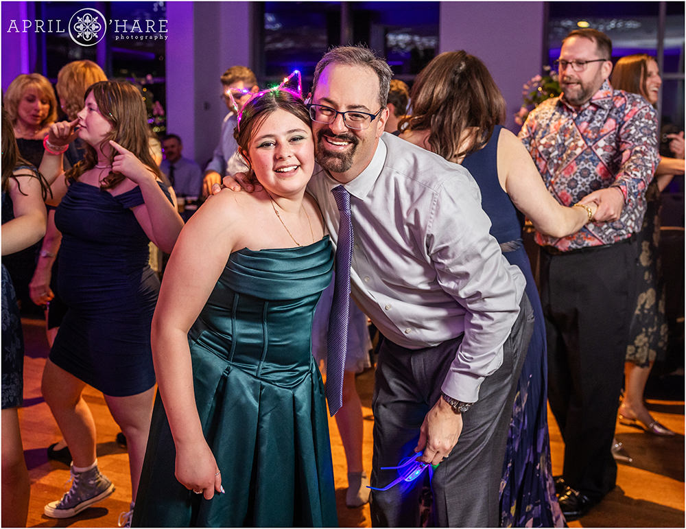 A girl with her dad at her bat mitzvah party at the Hyatt Regency DTC