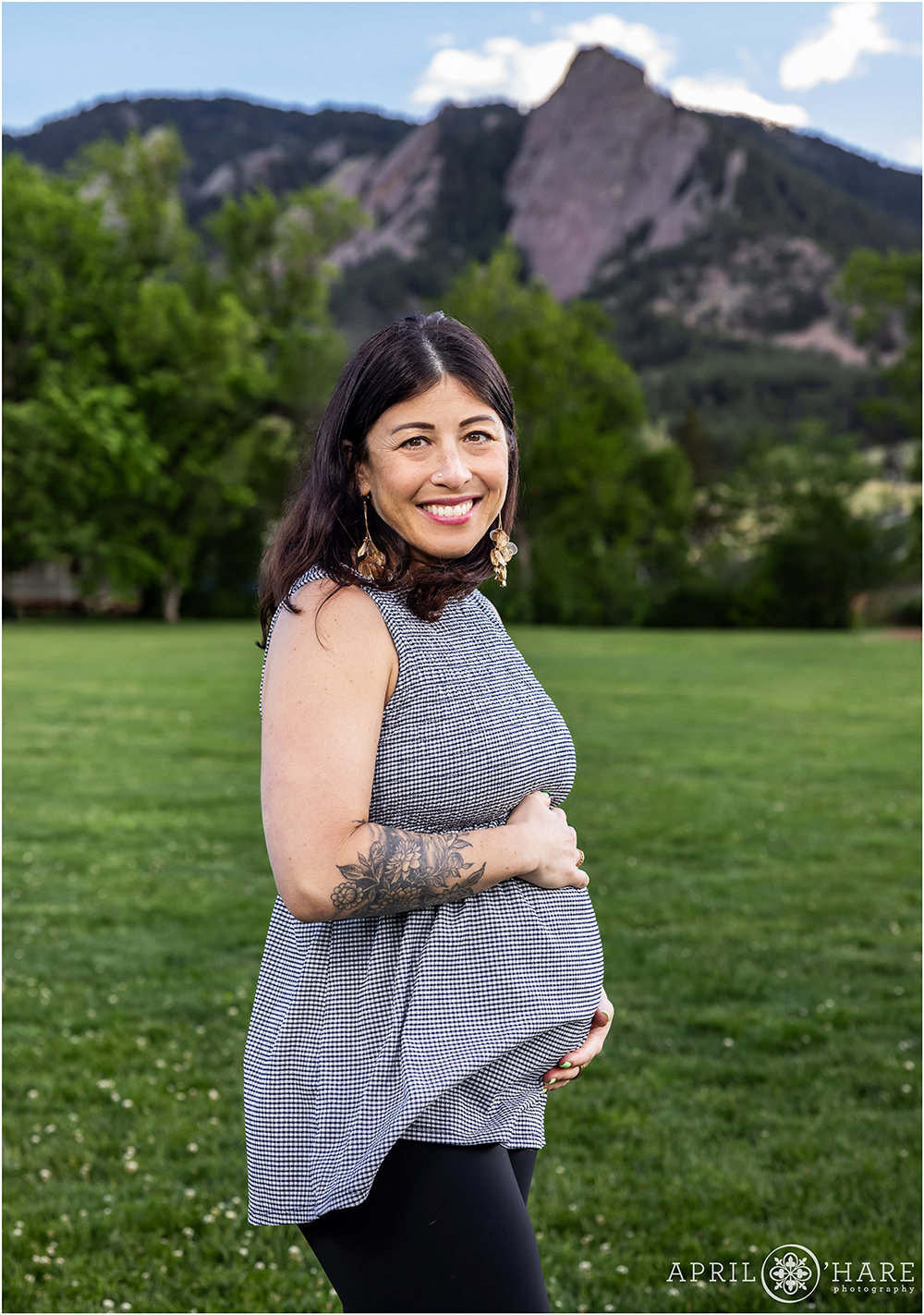 Cute pregnancy portrait with mountain backdrop at Chautauqua in Boulder CO