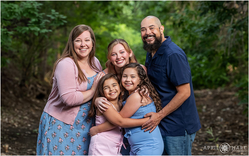 Family Photo in front of Tree Backdrop at Bible Park in Denver, CO